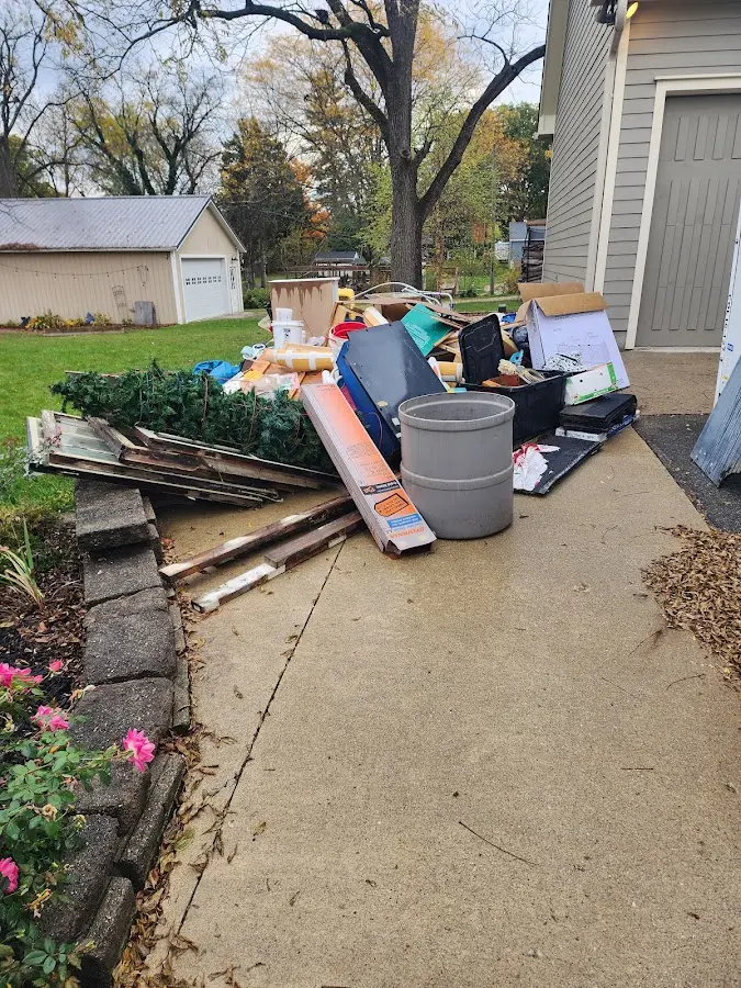 Dumpster being loaded with debris for Residential Dumpster Rental in Wolcott